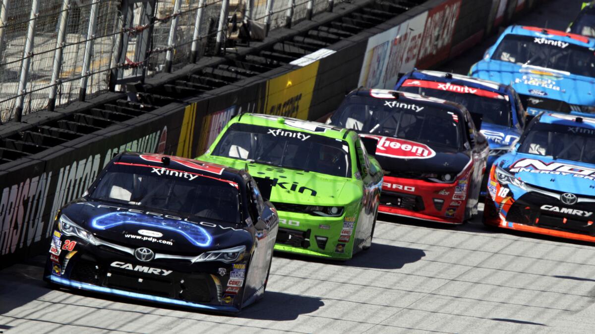 NASCAR driver Erik Jones (20) leads Kyle Larson and the rest of the field down the backstretch druing Xfinity Series race Saturday at Bristol Motor Speedway.