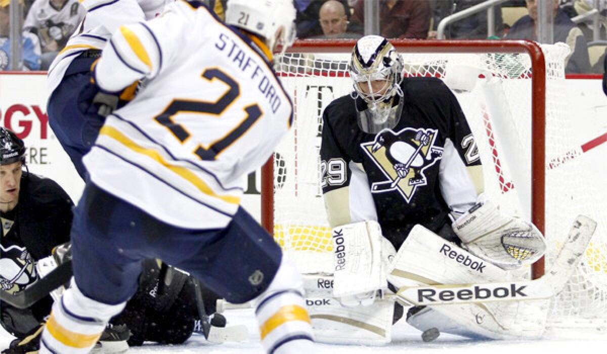 Marc-Andre Fleury makes a save on Drew Stafford during the Buffalo Sabres' 4-1 victory, which ended the Pittsburgh Penguins' winning streak at 15 games.