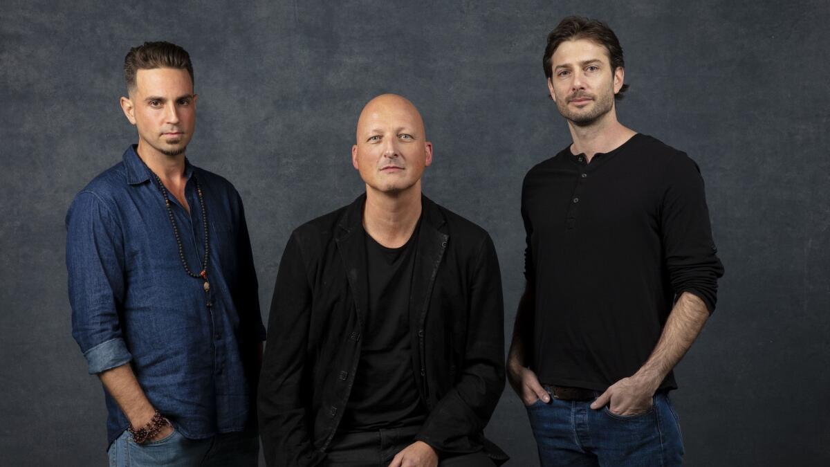 Subject Wade Robson, director Dan Reed, and subject James Safechuck, from the documentary "Leaving Neverland," photographed in the L.A. Times Photo and Video Studio at the 2019 Sundance Film Festival.