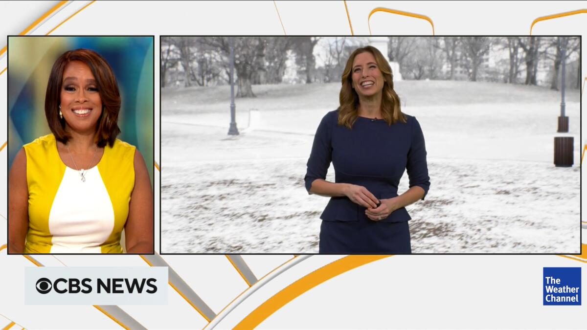 A woman in a newsroom speaks on a split screen to a woman in front of a snowy background.