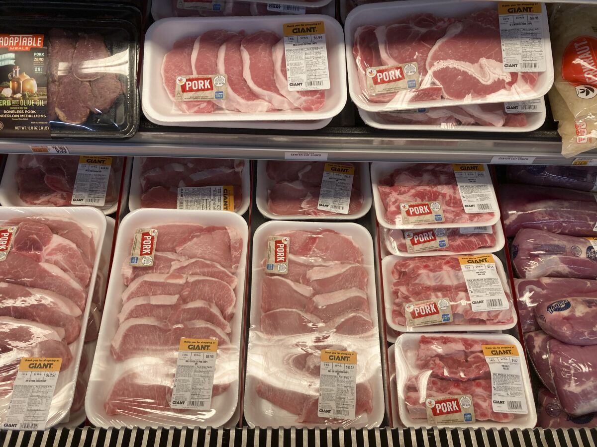 Shown are pork products at a grocery store in Roslyn, Pa., Tuesday, June 15, 2021. The Labor Department reported Thursday Oct. 14, that the monthly increase in its producer price index, which measures inflationary pressures before they reach consumers, was 0.5% for September compared to a 0.7% gain in August. (AP Photo/Matt Rourke)