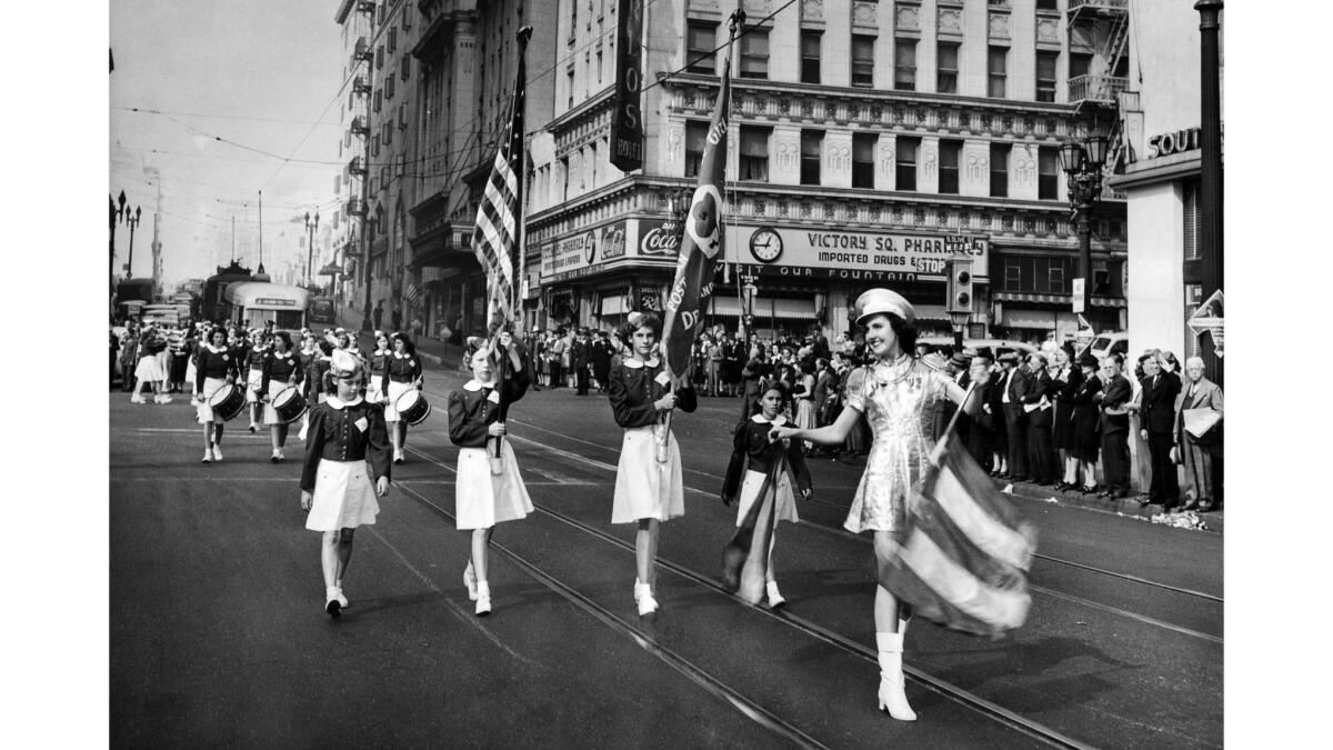 Nov. 11, 1943: The Monterey Park Girls' Drum and Bugle Corps march the fourth parade held in L.A. on Armistice Day. The annual parade was split into four smaller parades for different branches of the military.