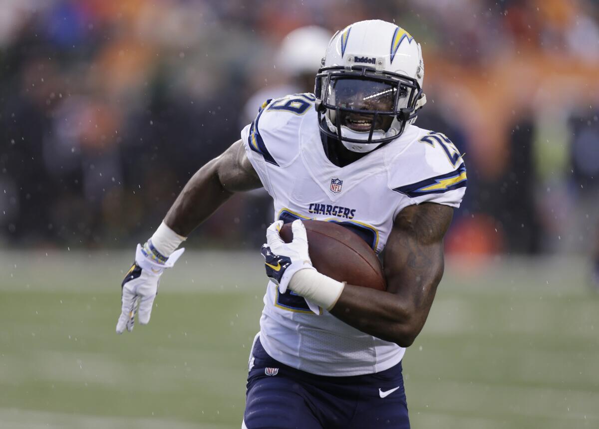 Chargers cornerback Shareece Wright returns an interception during a football game against the Bengals.