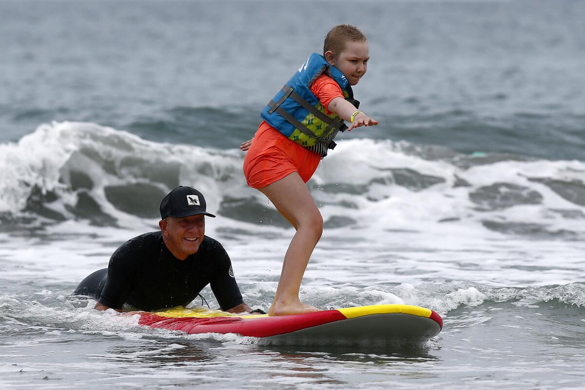 Critically ill children find respite in the surf during Miracles for Kids  camp - Los Angeles Times