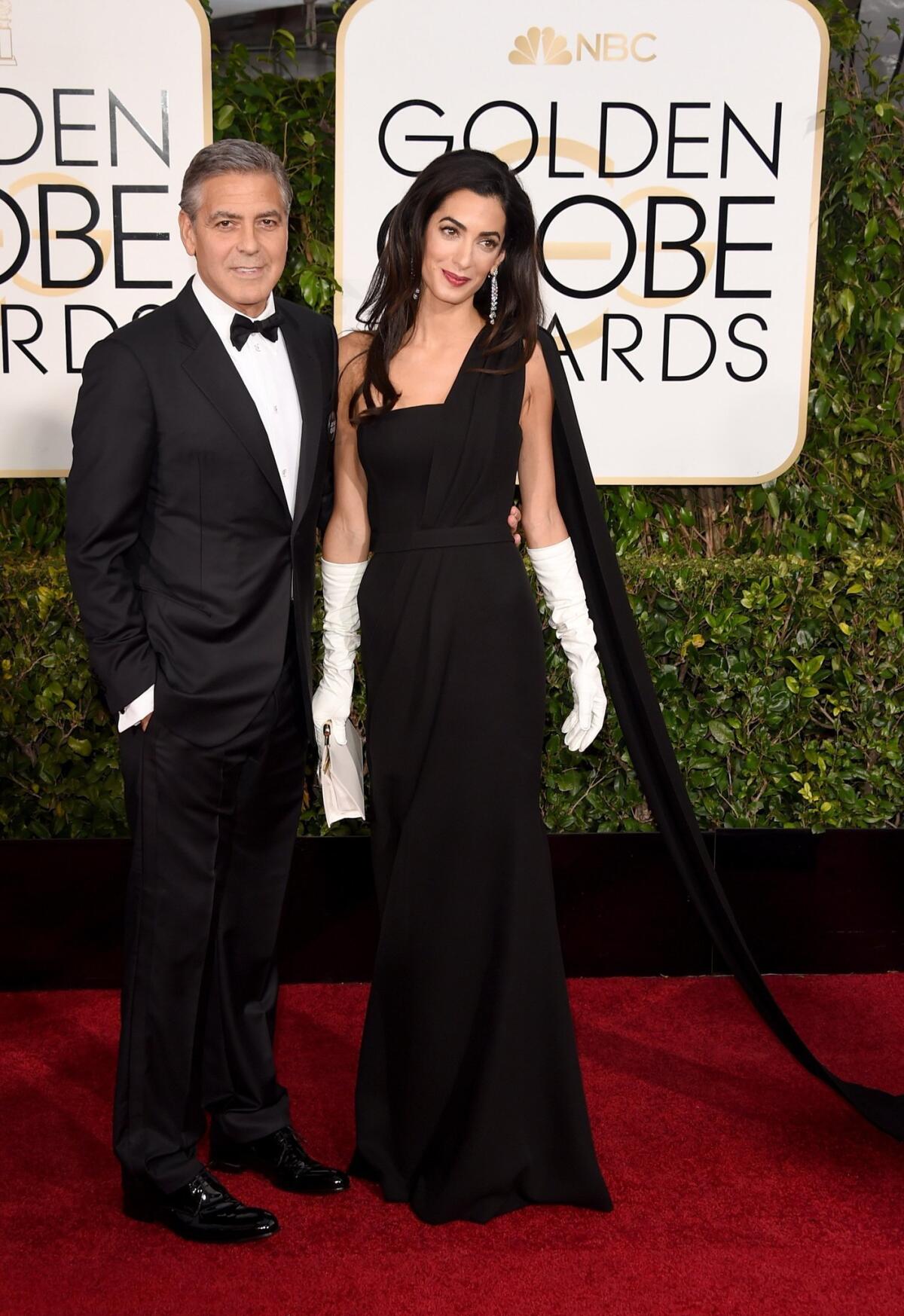 BEVERLY HILLS, CA - JANUARY 11: Actor George Clooney and lawyer Amal Alamuddin Clooney attend the 72nd Annual Golden Globe Awards at The Beverly Hilton Hotel on January 11, 2015 in Beverly Hills, California. (Photo by Jason Merritt/Getty Images) ** OUTS - ELSENT, FPG - OUTS * NM, PH, VA if sourced by CT, LA or MoD **