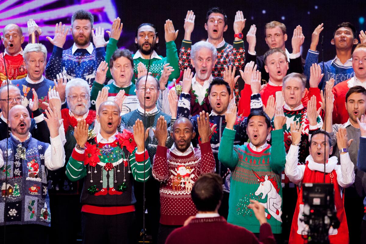 The Gay Men's Chorus of Los Angeles decked out in various Christmas sweaters