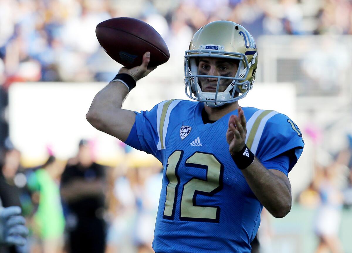 UCLA quarterback Mike Fafaul throws a pass against Utah in the fourth quarter on Oct. 22.