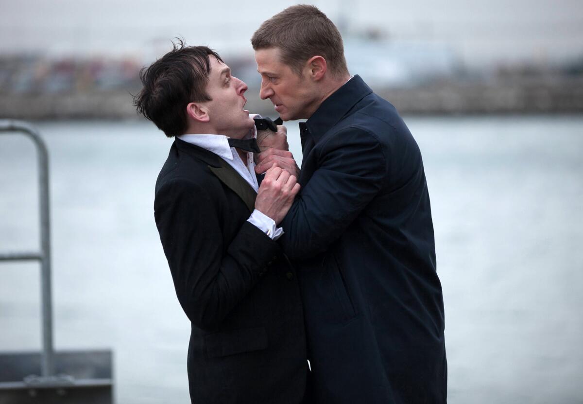 In this image released by Fox, Robin Lord Taylor, left, and Ben McKenzie, are shown in a scene from "Gotham," which premiered on Monday, Sept. 22.