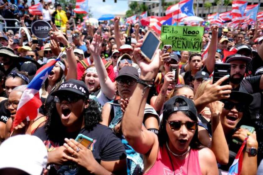 People march in San Juan on July 25, 2019, one day after the resignation of Puerto Rico Governor Ricardo Rossello. - Puerto Rico's embattled governor announced his resignation late July 24, following two weeks of massive protests triggered by the release of a text exchange in which he and others mocked gay people, women and hurricane victims. "I announce that I will be resigning from the governor's post effective Friday, August 2 at 5 pm," Rossello said, in a video statement posted on the government's Facebook page.