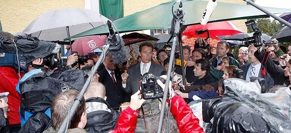 Austrian-born actor and former Californian Gov. Arnold Schwarzenegger is surrounded by journalists before the inauguration ceremony of the Arnold Schwarzenegger museum in the house where he was born in Thal, near Graz, Austria.