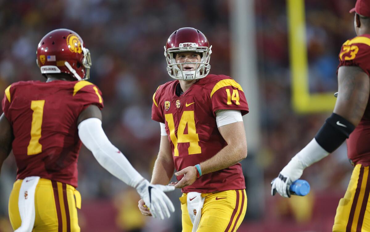 USC quarterback Sam Darnold (14) and receiver Darreus Rogers (1) smile after leading the Trojans to a commanding lead over Arizona State on Oct. 1.