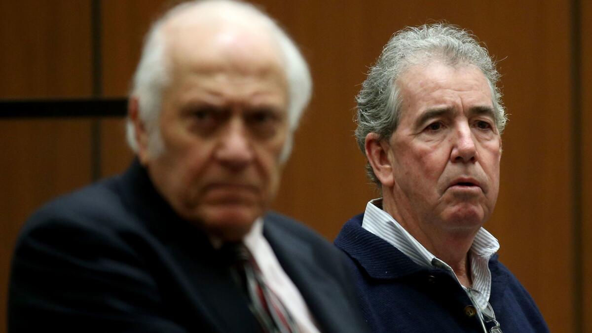 Patrick T. Lynch, right, the former general manager of the Los Angeles Memorial Coliseum, with his lawyer at a court hearing last month.