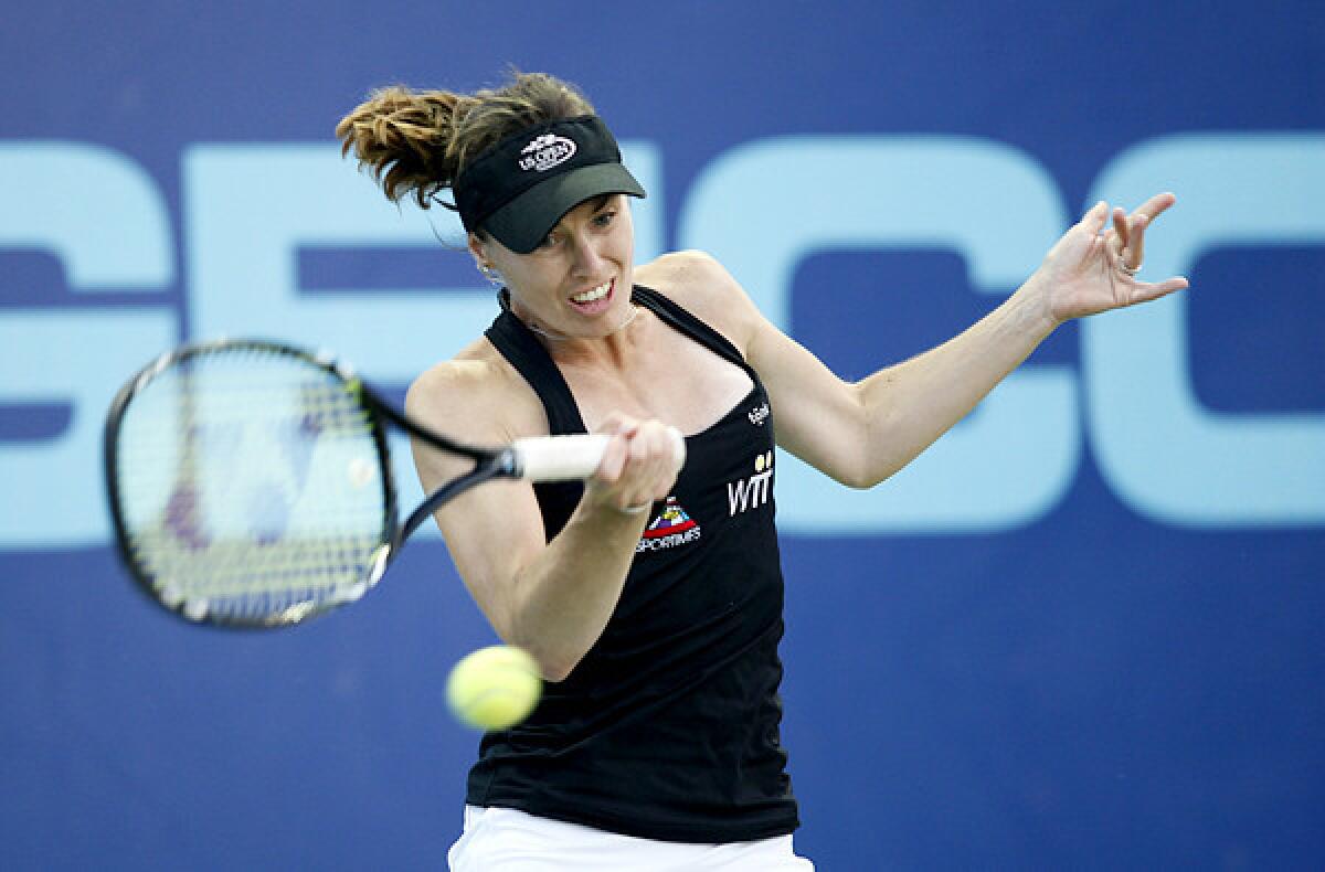 Martina Hingis returns a shot against Anne Keothavong during a World Team Tennis match in Newport Beach.