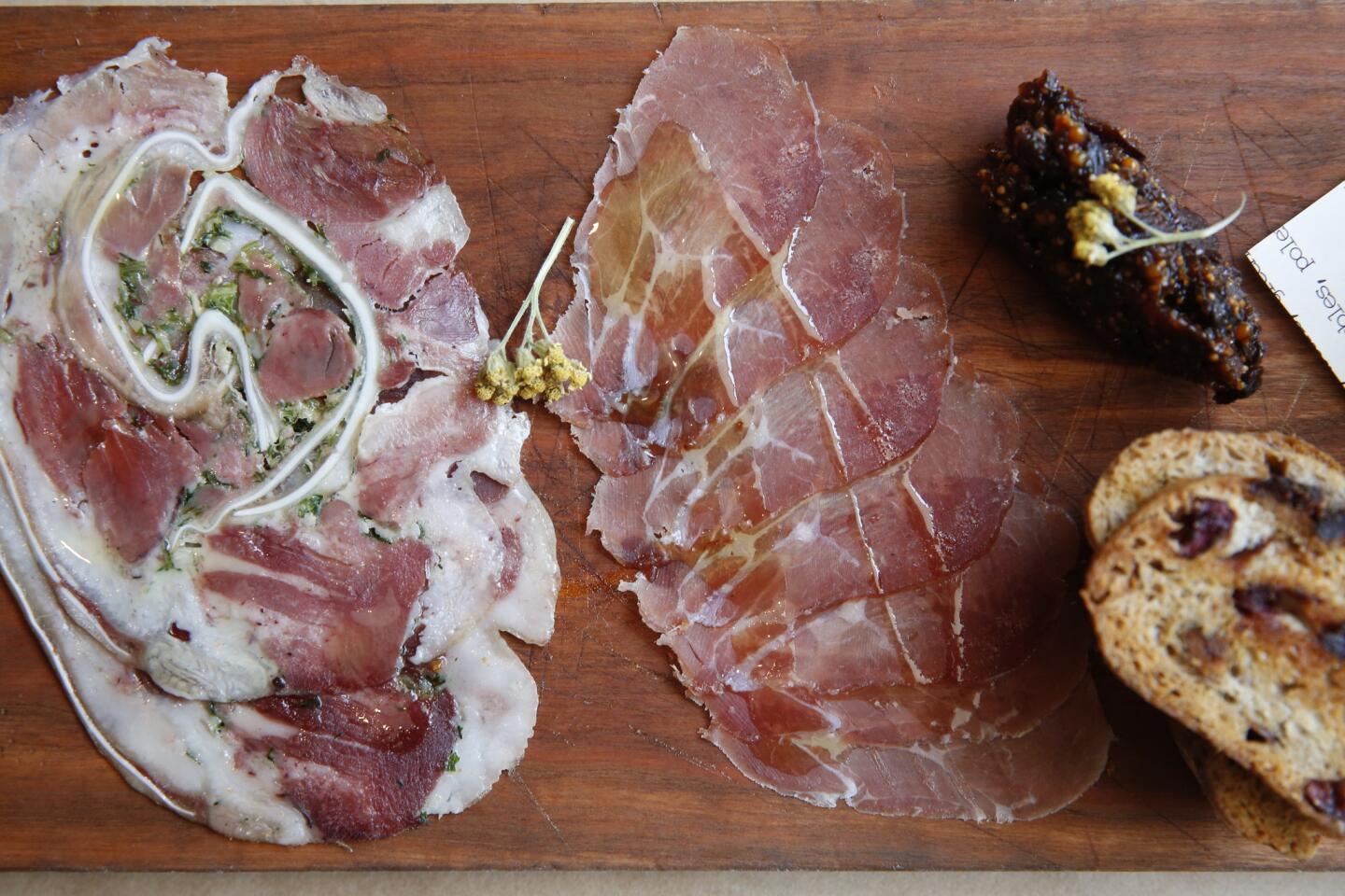 An antipasti, with cured meats, cheese, pickles and mustard. Many of the dishes at Union are served on wood slabs to match the restaurant's simple decor.