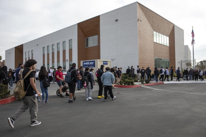 San Diego, California - August 29: Students head to the first day of school at the Logan Memorial Education Campus on Monday, Aug. 29, 2022 in San Diego, California. LMEC's high school will open this fall. (Ana Ramirez / The San Diego Union-Tribune)