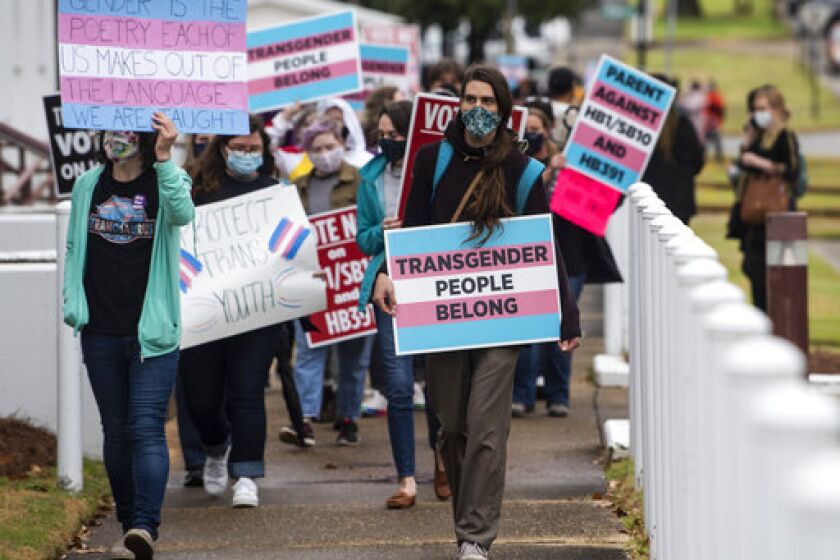 Protestors in support of transgender rights march around the Alabama State House in Montgomery, Ala., on Tuesday, March 2, 2021. (Jake Crandall//The Montgomery Advertiser via AP)