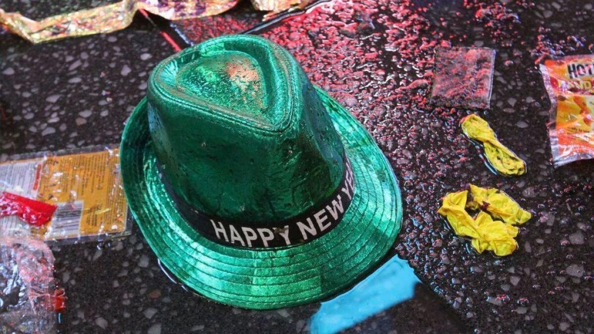 A "Happy New Year" hat lies on the wet ground following the celebration in New York's Times Square on Jan. 1.
