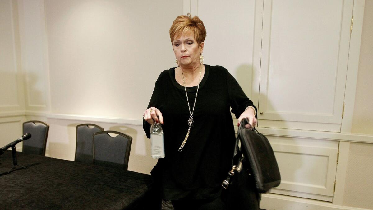 Beverly Young Nelson leaves a news conference on Dec. 8, 2017, in Atlanta after presenting evidence that Alabama U.S. Senate candidate Roy Moore signed her yearbook.