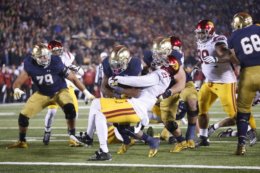 Notre Dame running back C.J. Prosiseplows into the end zone on a six-yard touchdown run against USC during the fourth quarter of a game on Oct. 17.