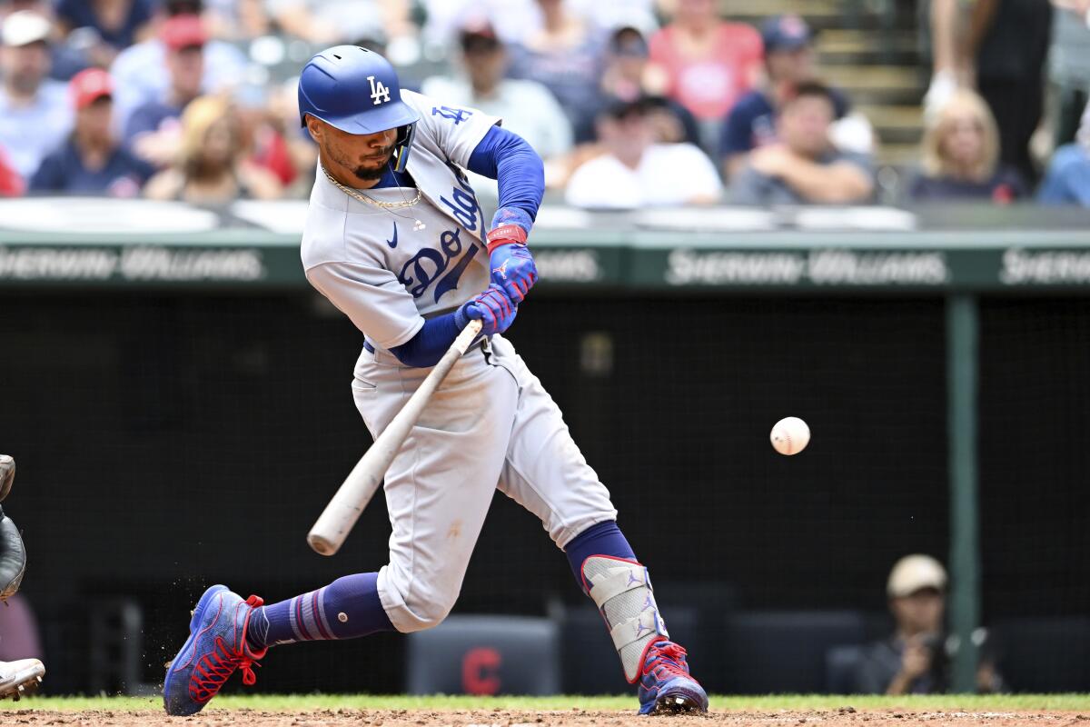 Dodgers right fielder Mookie Betts hits a two-run double during the eighth inning in the first game of a doubleheader.