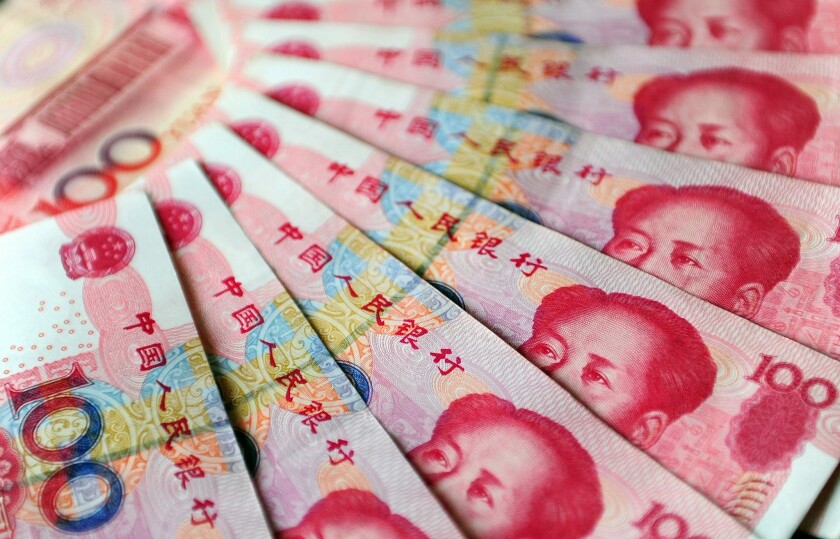 China's central bank recently issued "digital yuan" that will eventually replace cash in circulation, such as these 100 yuan notes. 