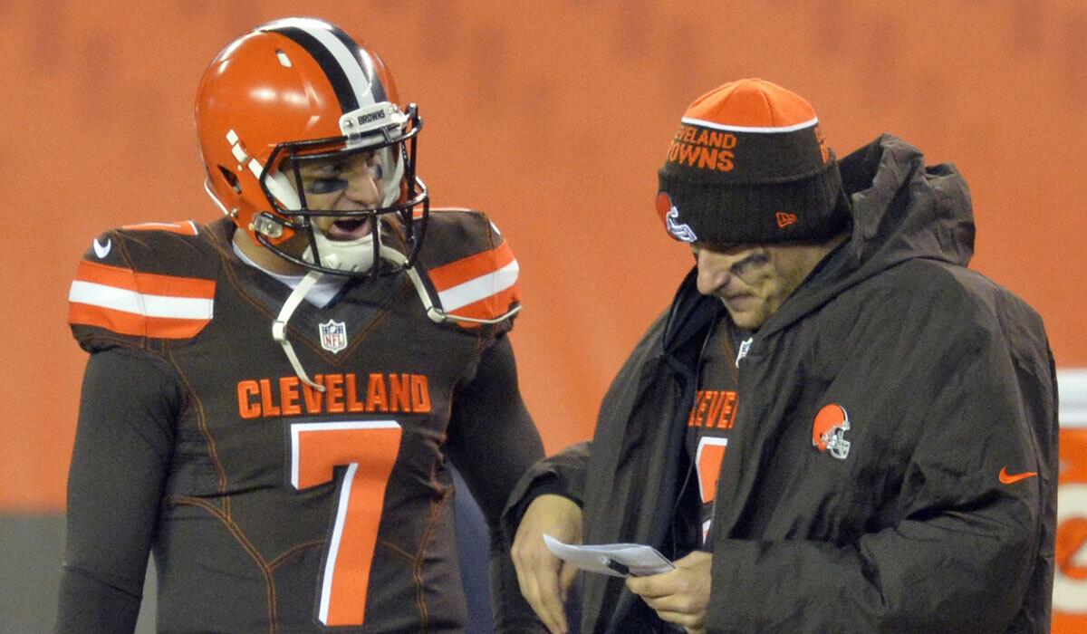 Cleveland quarterbacks Johnny Manziel, right, and Austin Davis talk during a game against Baltimore on Monday night.