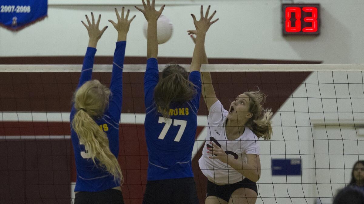 Laguna Beach High's Soren Patchell, right, shown battling at the net against Fountain Valley on Nov. 1, 2016, led the Breakers to a sweep of Los Alamitos on Thursday.