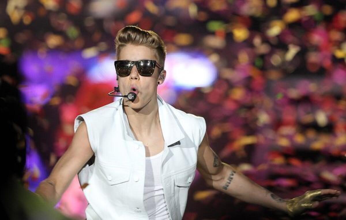 Justin Bieber performs in Dubai, United Arab Emirates, last week. A recent poll shows less love for the Biebs than his fans might think.
