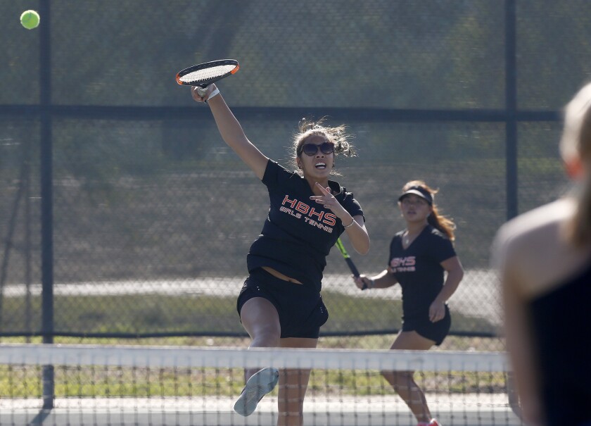 Huntington Beach doubles players Cindy Huynh, left, and Sophie Jin-Ngo, right, during Wednesday's competition.