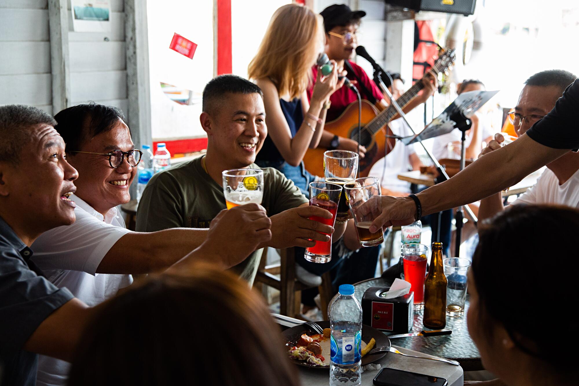 Patrons enjoy a beer at Chit Beer, a craft brewery on Koh Kret island upriver from Bangkok, Thailand.