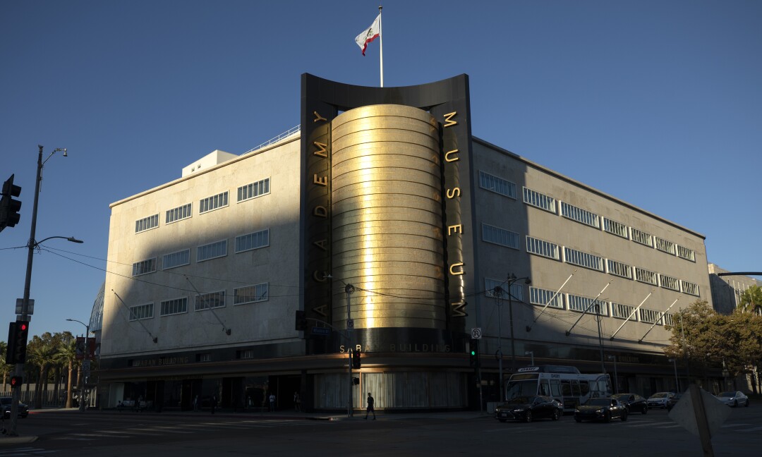 The golden mosaic cylinder on the corner of the old May Co. building glimmers in afternoon light