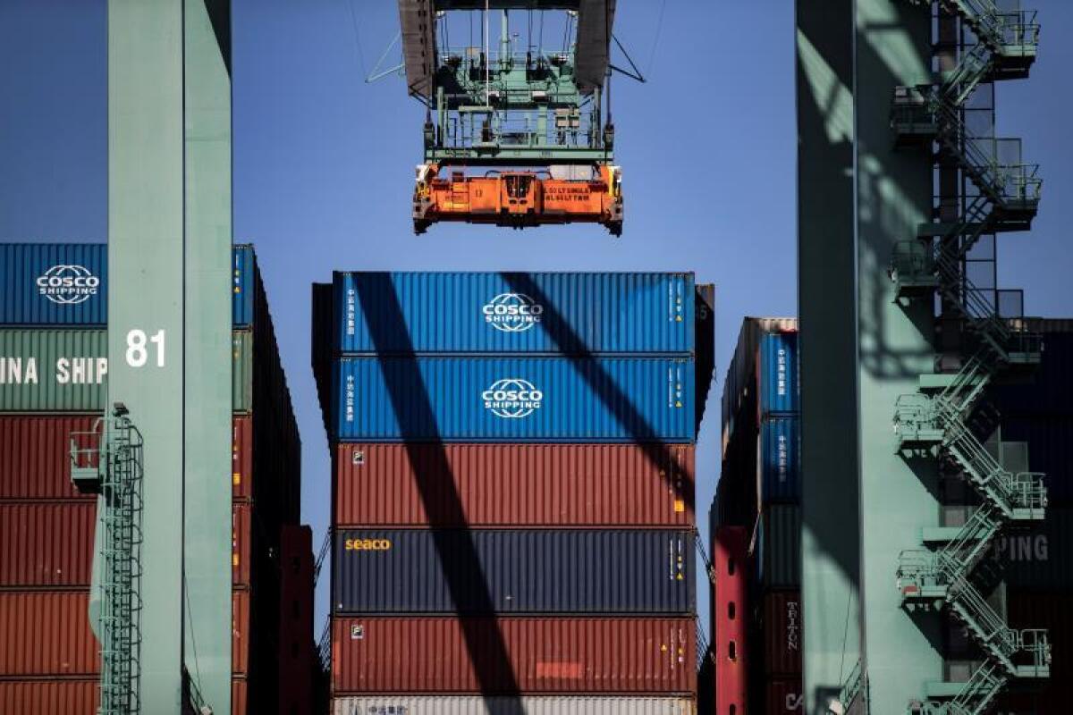 Containers are unloaded from the CSCL Yellow Sea cargo ship at the Los Angeles Port in Los Angeles, California. EFE/EPA/Etienne Laurent/File