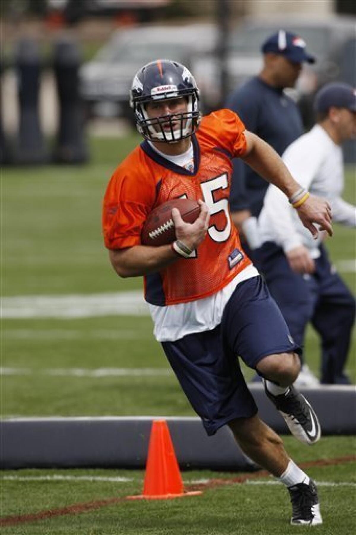 Tebow dons Broncos jersey for 1st time