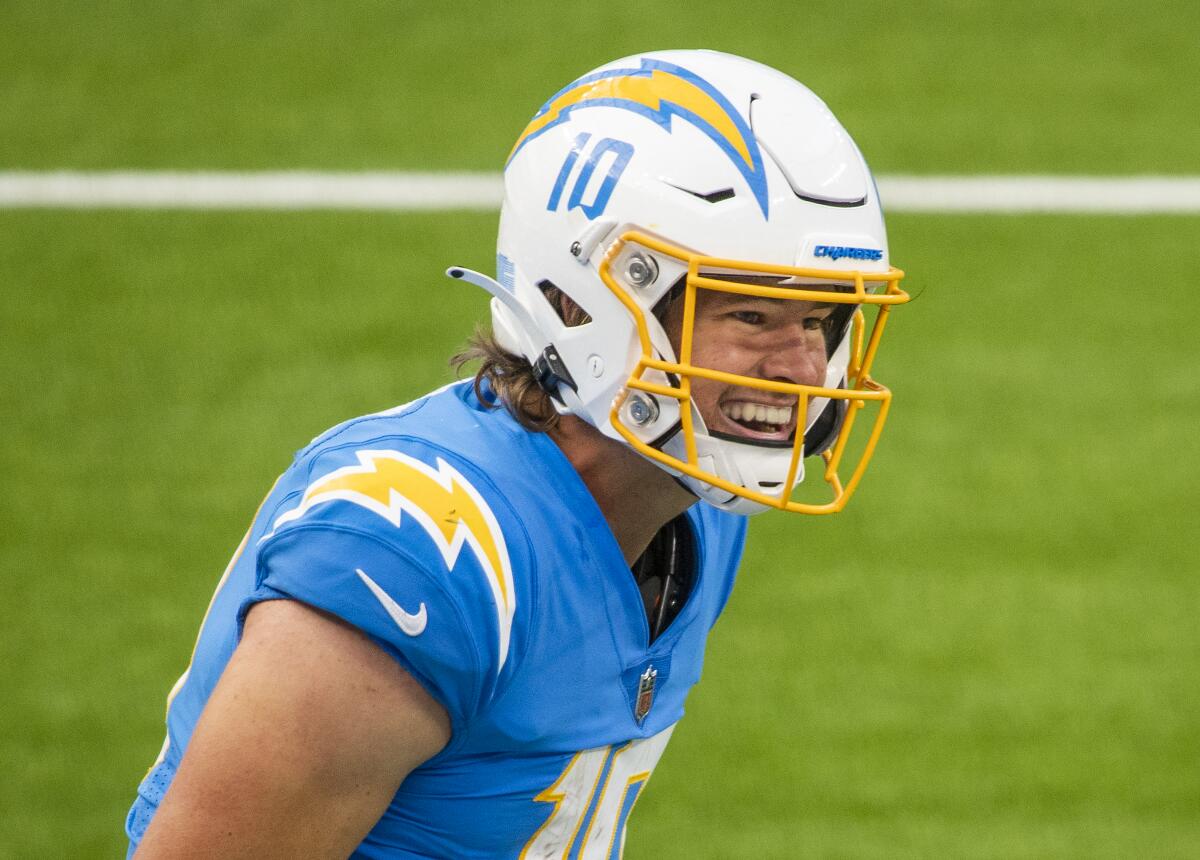 Chargers quarterback Justin Herbert celebrates after a five-yard touchdown run.