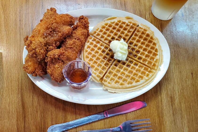 Waffles and chicken tenders, and a lemonade-iced tea, at Roscoe's House of Chicken and Waffles.