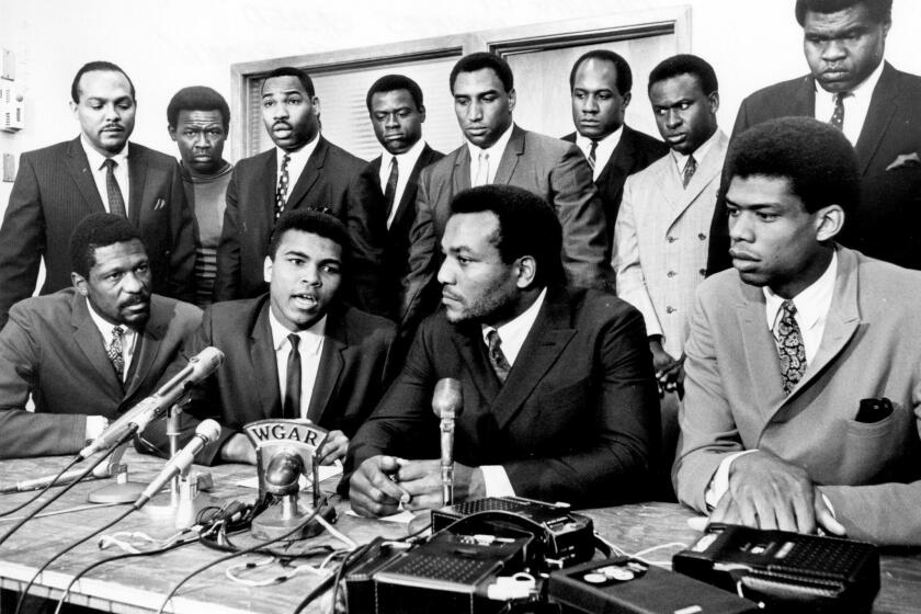 Former Cleveland Browns Hall of Fame running back Jim Brown presides over a meeting of top African American athletes in 1967.