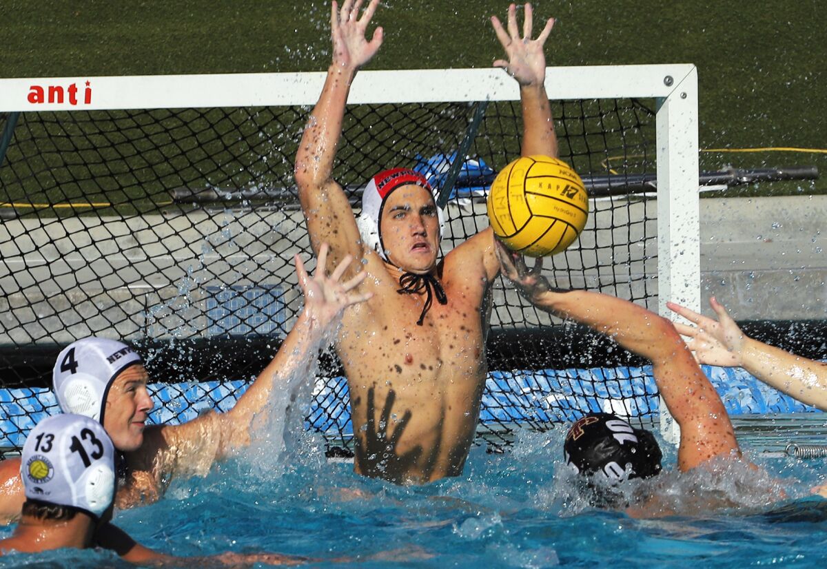 Newport Harbor goaltender Cooper Mathisrud (1) leaps to make a save during the Sailors game against JSerra on Saturday.