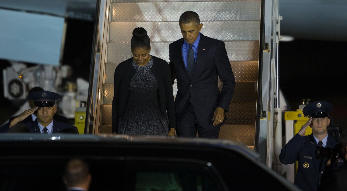 President Obama and First Lady Michelle Obama depart Air Force One at San Bernardino International Airport.