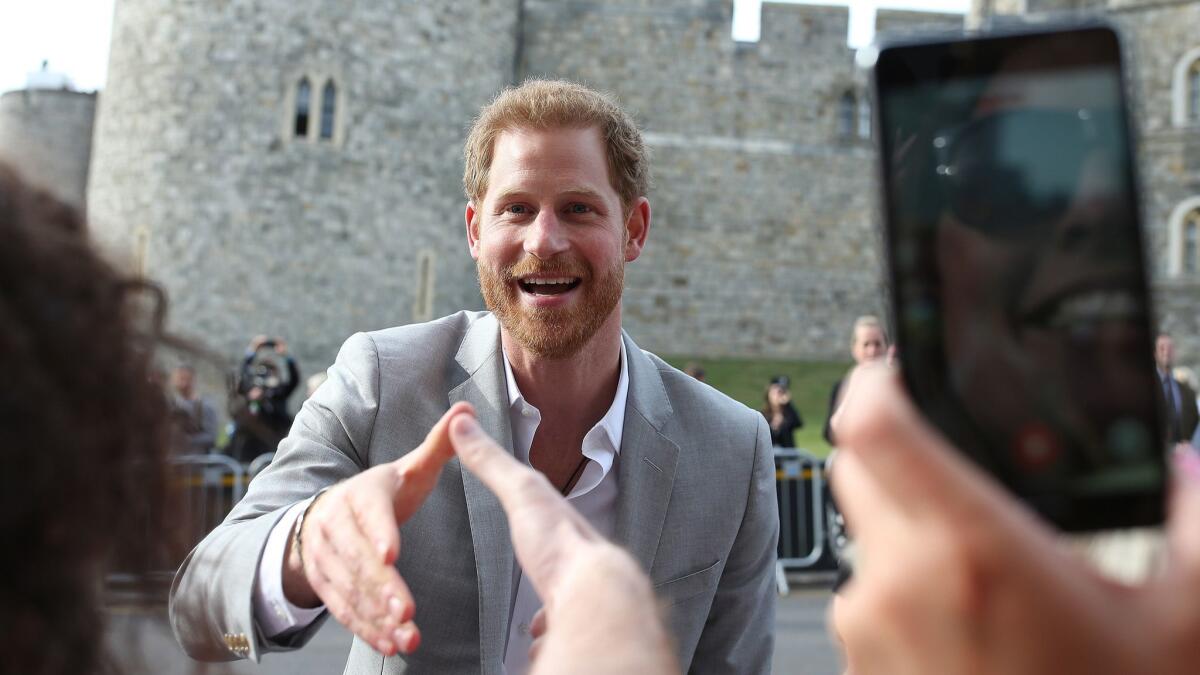 Britain's Prince Harry greets the crowd in Windsor, England, on May 18.