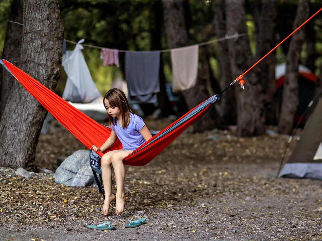Molly McClure, 7, of Monrovia camps with her dad, Kyle, at the Crystal Lake campground.