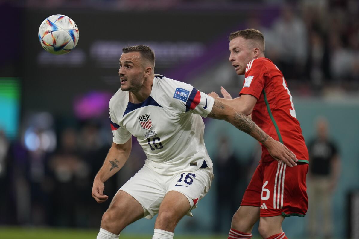 U.S. forward Jordan Morris, left, and Wales defender Joe Rodon battle for the ball during a 1-1 draw.