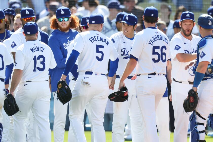 LOS ANGELES, CA - MARCH 28: The Los Angeles Dodgers celebrate after defeating the St. Louis Cardinals.