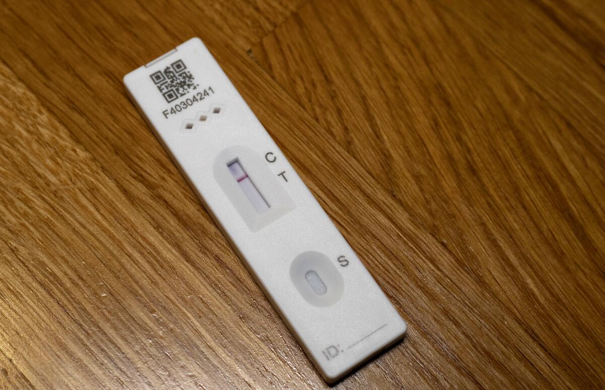 An Innova COVID-19 lateral flow self-testing kit returns a negative flow test result.