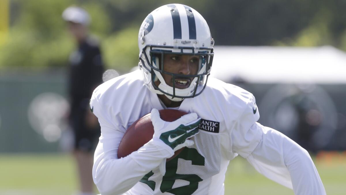 New York Jets wide receiver Jalen Saunders runs after making a catch during a training camp session in July.