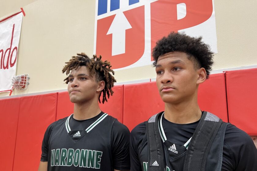 Brothers Marcus Adams Jr. (left) and Maximo led Narbonne to a 64-62 win over Long Beach Millikan.