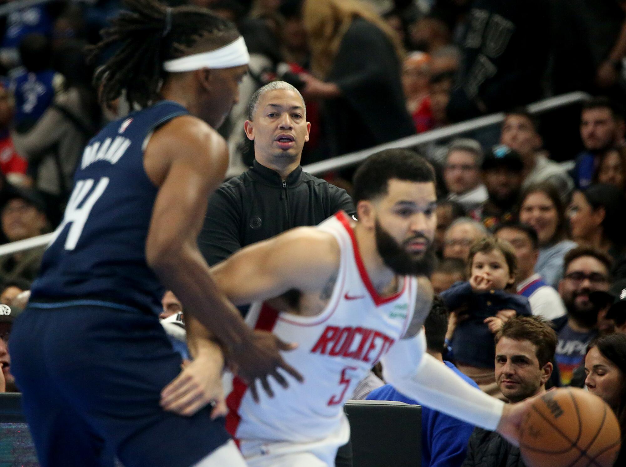 Clippers coach Tyronn Lue watches from the sideline as guard Terance Mann defends Houston's Fred VanVleet.