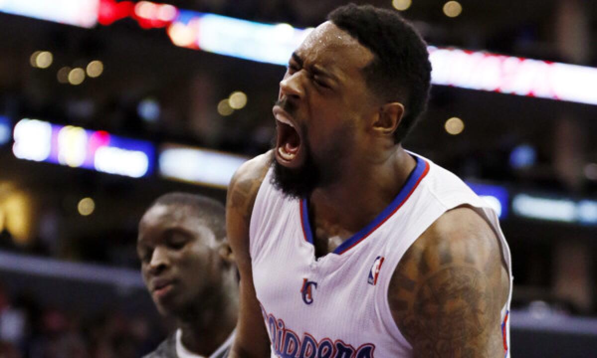 Clippers center DeAndre Jordan celebrates a dunk during a win over the Orlando Magic on Monday. Jordan is averaging a league-best 13.5 rebounds per game.