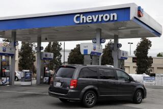 FILE - A motorist drives near the pumps at a Chevron gas station in Oakland, Calif., on April 25, 2017. Chevron is buying Hess Corp. for $53 billion as the biggest U.S. oil companies use a recent windfall in profits to buy up smaller competitors, Chevron said in a press release Monday, Oct. 23, 2023. (AP Photo/Ben Margot, File)