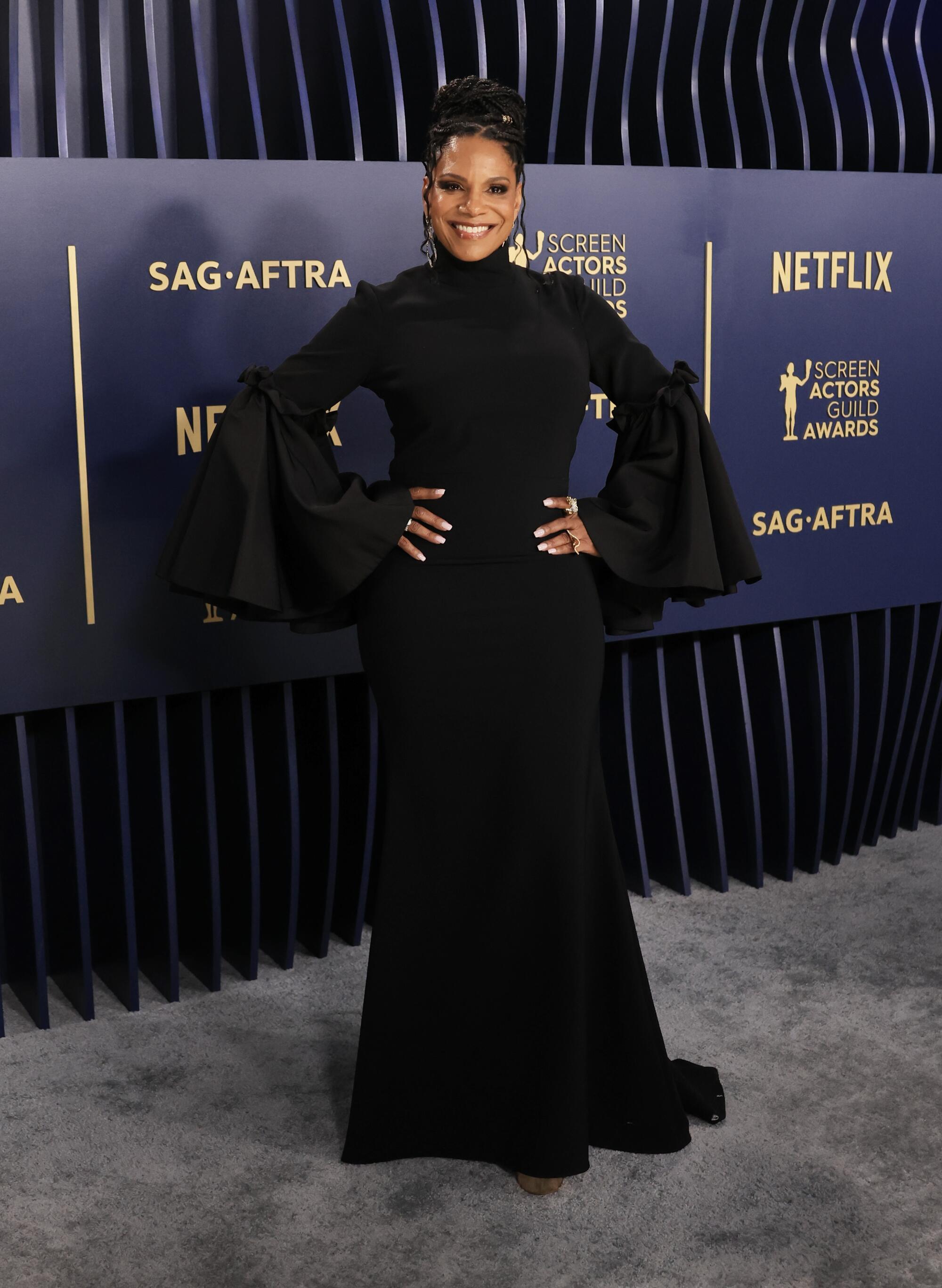 Audra McDonald wears a black long-sleeved dress to the SAG Awards.