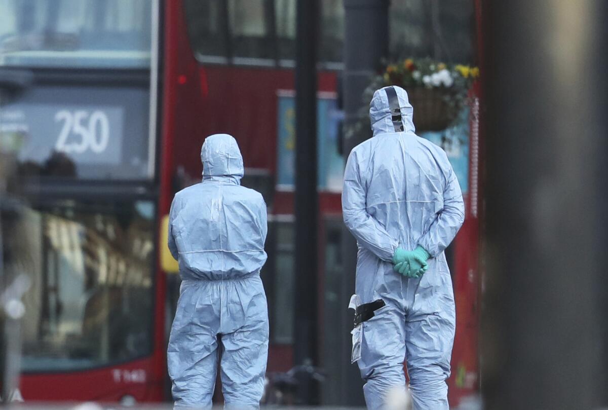 Police forensic officers at the scene of a stabbing attack in the Streatham area of south London.
